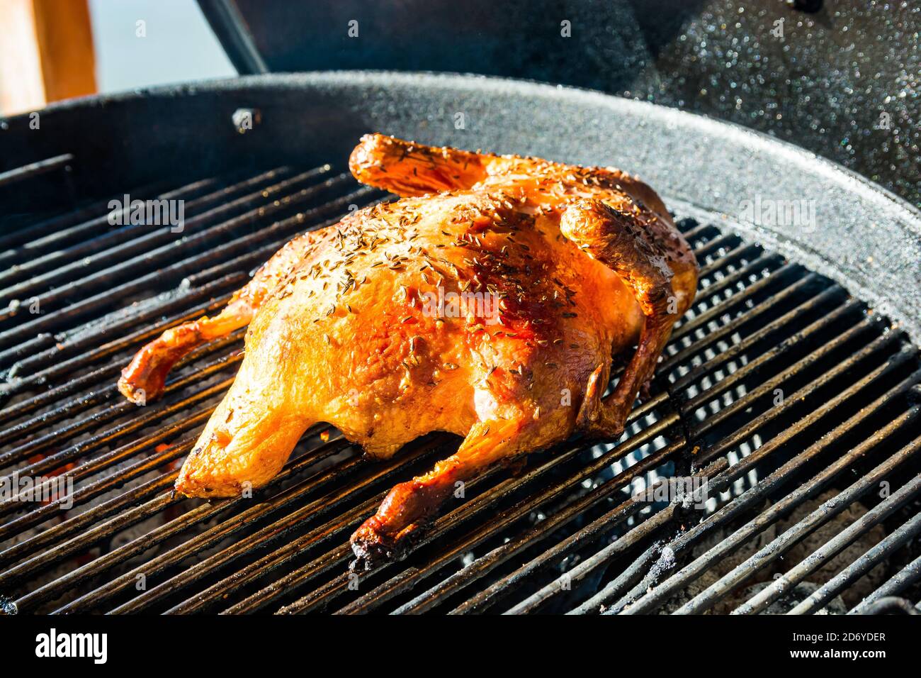 Baked duck preparing on the grill with a coal Stock Photo Alamy