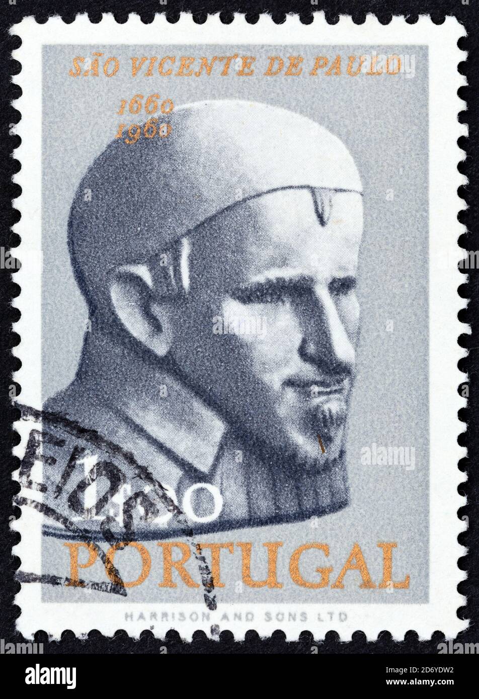PORTUGAL - CIRCA 1963: A stamp printed in Portugal issued for the 300th death anniversary of St. Vincent de Paul shows St. Vincent de Paul, circa 1963. Stock Photo