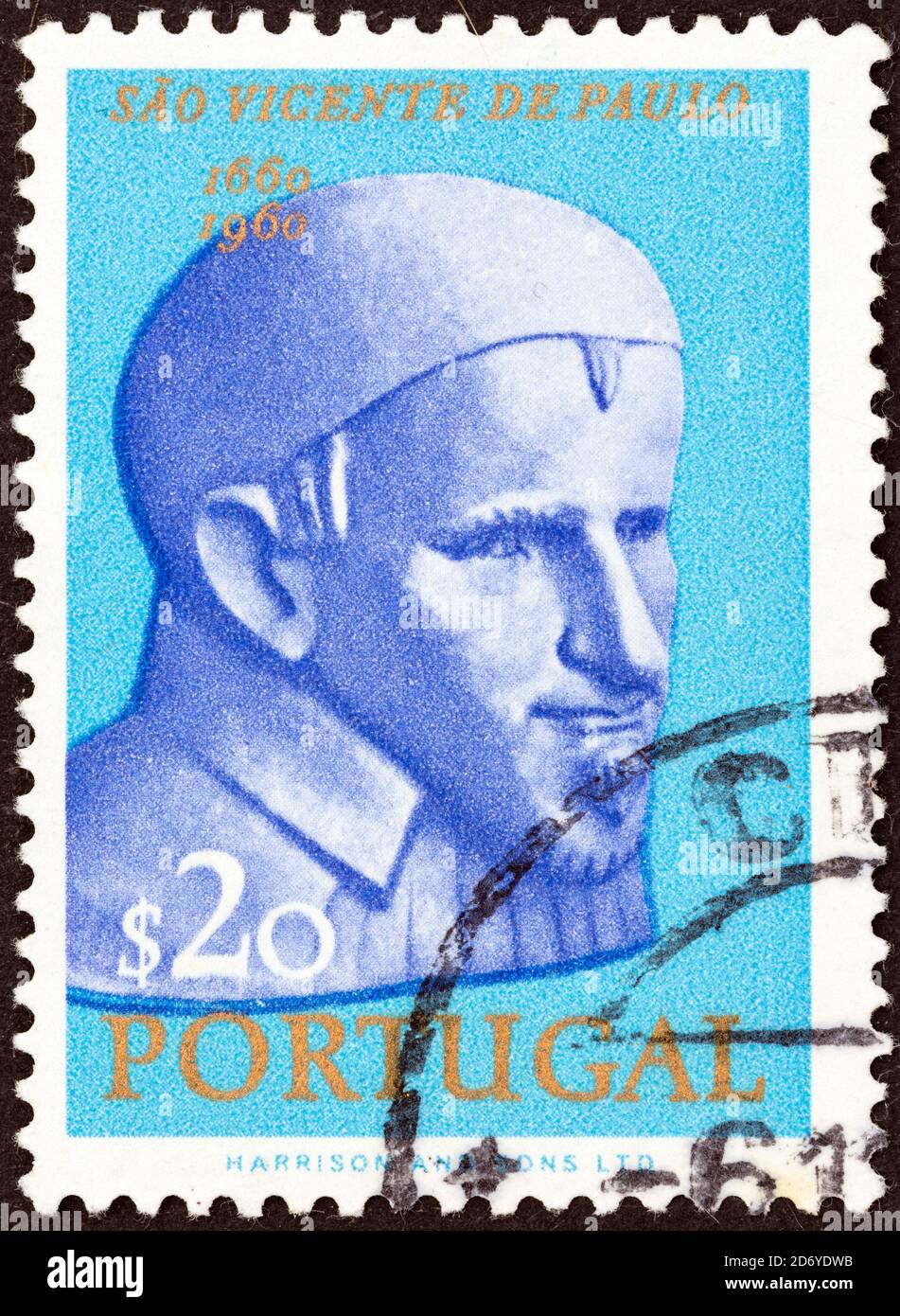 PORTUGAL - CIRCA 1963: A stamp printed in Portugal issued for the 300th death anniversary of St. Vincent de Paul shows St. Vincent de Paul. Stock Photo
