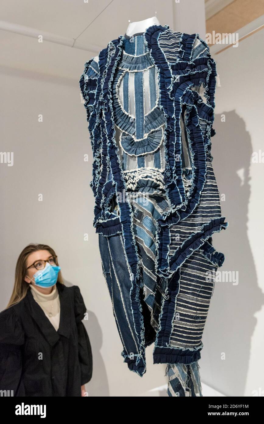 London, UK.  20 October 2020. A staff member views a creation by designer Nkwo Onwuka called 'Dakala Cloth'. Preview of the Beazley Designs of the Year at the Design Museum in Kensington.  The most innovative designs from January 2019 to the moment the COVID-19 pandemic took hold are on display 21 October to 28 March 2021. Credit: Stephen Chung / Alamy Live News Stock Photo