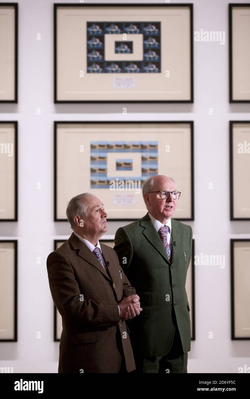 Artists Gilbert Proesch (l) and George Passmore (r) pictured at the press view of their latest exhibition, The Urethra Postcard Art of Gilbert and George, at the White Cube gallery in central London.  Stock Photo