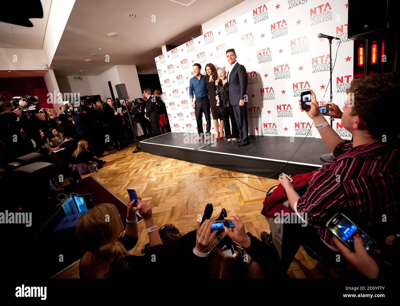 X Factor representitives Matt Cardle, Cheryl Cole, SIobhan Green and Simon Cowell pictured in the press room at the National Television Awards, at the O2 centre in east London. Stock Photo