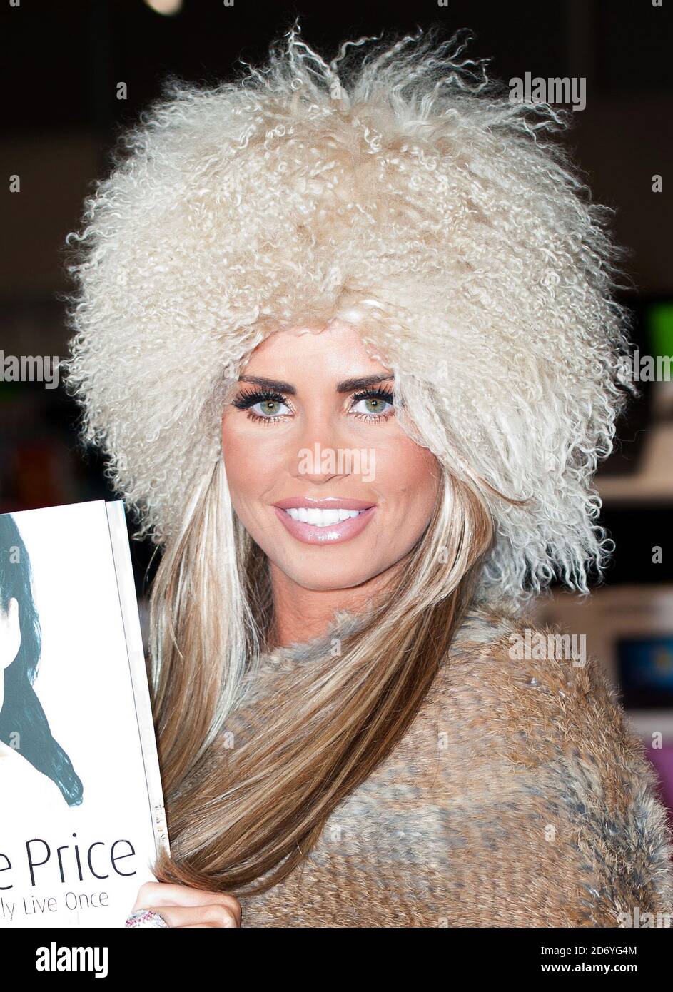Katie Price poses before signing copies of her latest book, 'You Only Live Once' at Asda in Milton Keynes. Stock Photo