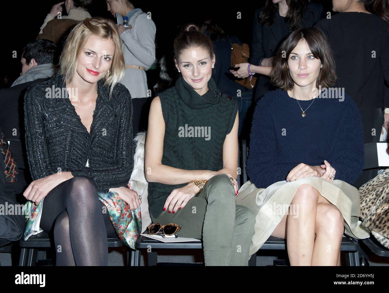 (l-r) Jacquetta Wheeler, Olivia Palermo and Alexa Chung attending the Erdem fashion show, held at the University of Westminster as part of London Fashion Week. Stock Photo