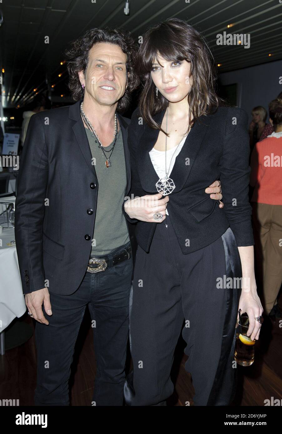 Stephen Webster and Daisy Lowe (wearing £1m of Webster Diamonds) attending the Wrigleys Extra Ice Eat Drink and Chew banquet, at Smiths of Smithfield in London.  Stock Photo