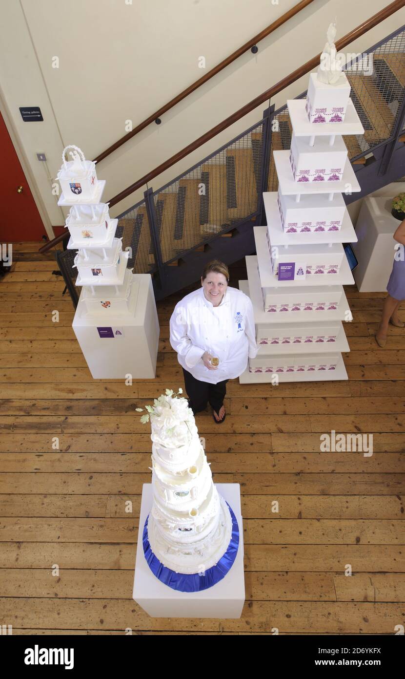 Creator Julie Walsh with her replica of King George VI and the Queen Mothers' wedding cake, at the Tate and Lyle 'Let Them Eat Cake' exhibition of royal themed cakes, at the Wellington Arch in central London. Stock Photo