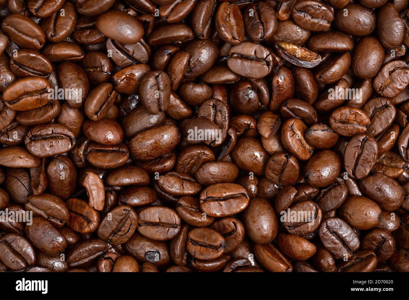 Roasted dark coffee beans background from close up Stock Photo - Alamy