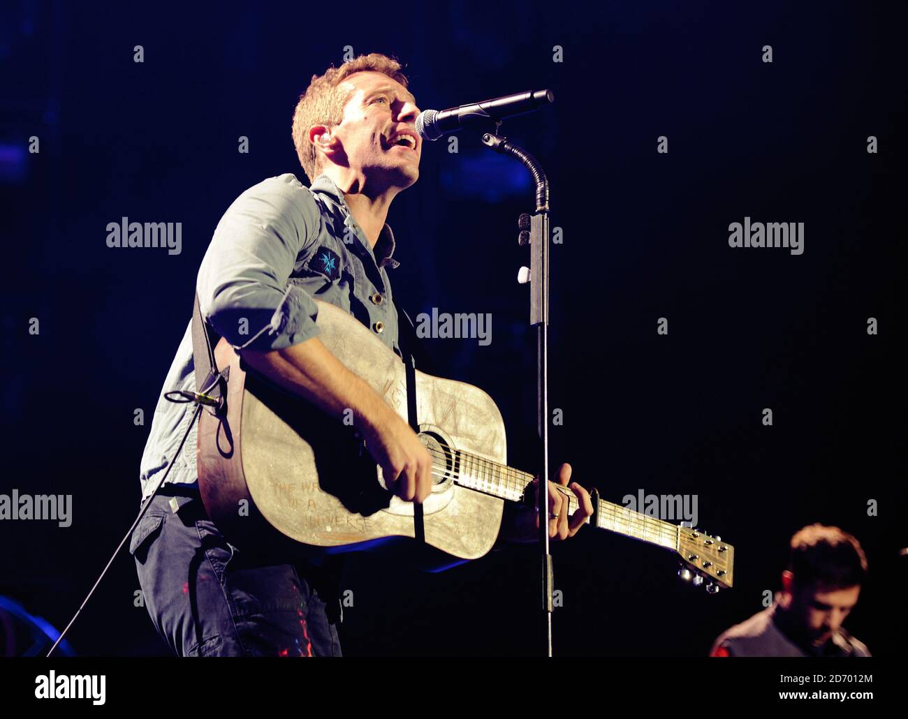 EDITORIAL USE ONLY NO MERCHANDISING Chris Martin of Coldplay performing at  Under One Roof, a charity concert in aid of the Kids Company, at the O2  Arena in central London Stock Photo -