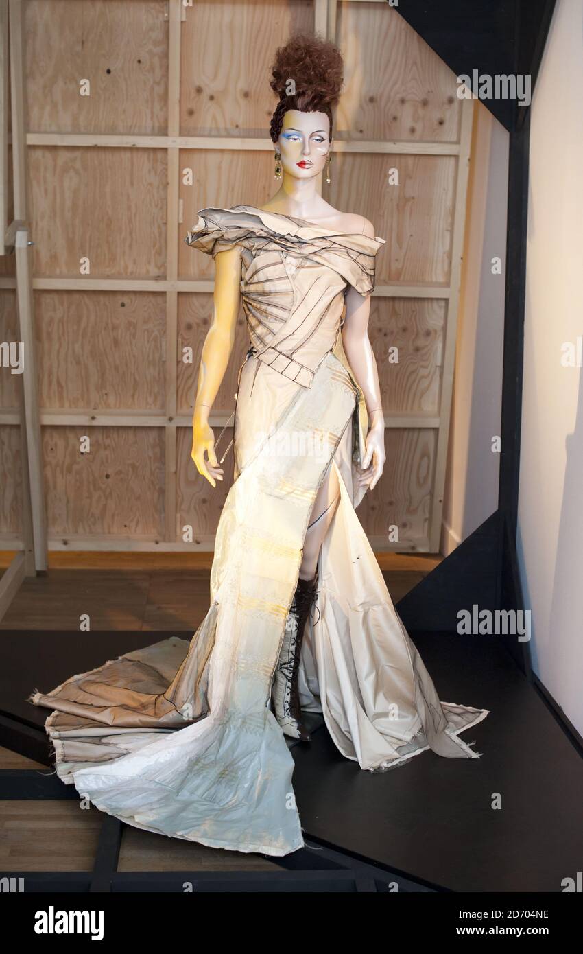A dress by John Galliano on display at British Design 1948-2012: Innovation in the Modern Age, at the Victoria and Albert Museum in London. Stock Photo
