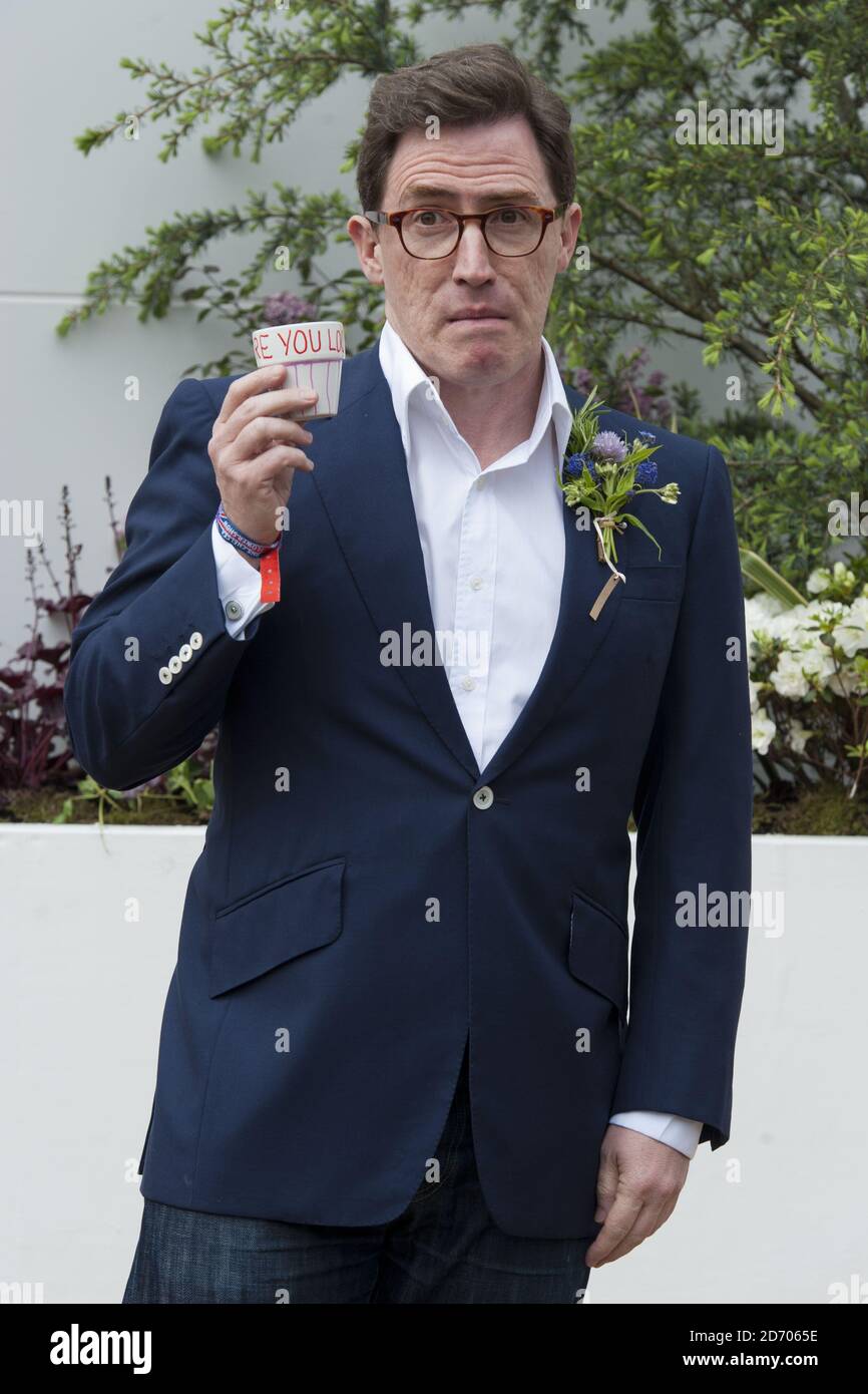 Rob Brydon pictured with a pot he designed at the RHS Pot Art stand, at the Chelsea Flower Show in west London. Stock Photo