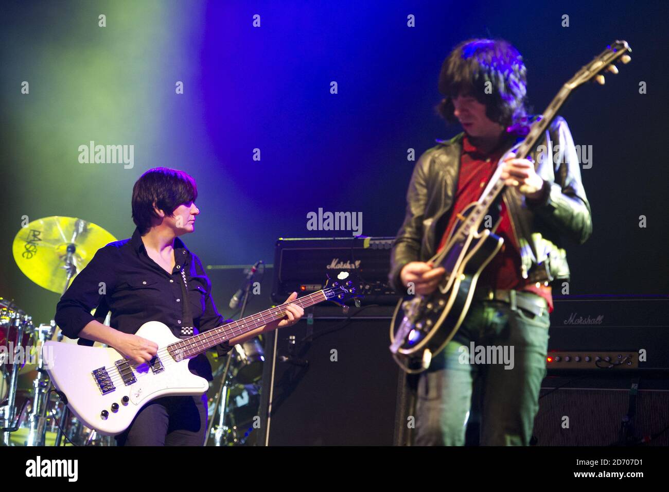 New bass player Debbie Googe and guitarist Andrew Innes performing with Primal Scream, on the eve of the Isle of Wight festival, at Seaclose Park. Stock Photo