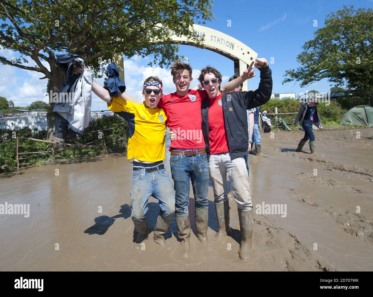 England Fans brave the mud at the Isle of Wight festival, at Seaclose Park, Newport Stock Photo