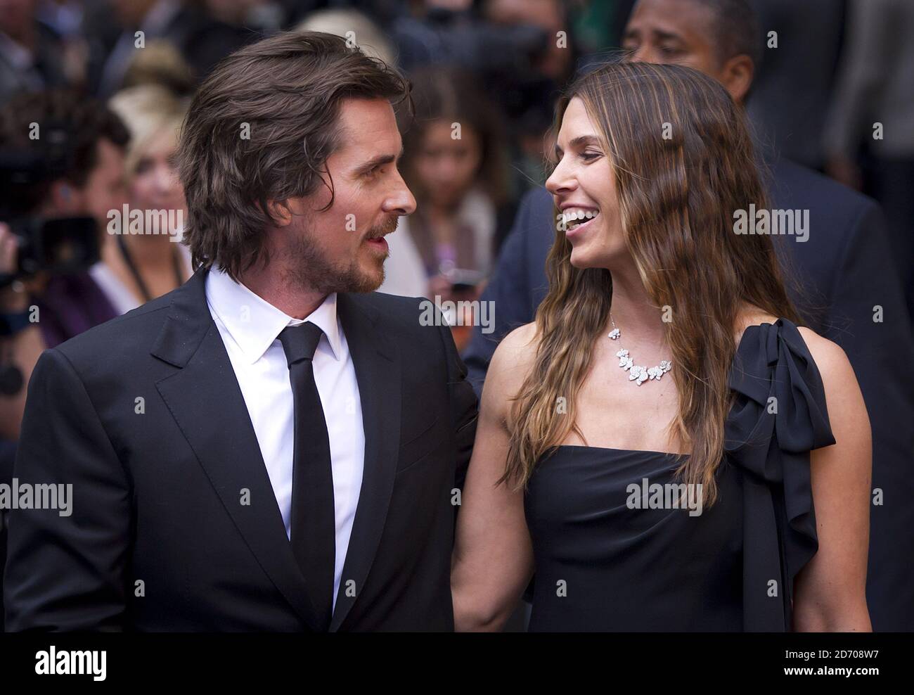 Christian Bale and Sibi Blazic arriving at the premiere of The Dark