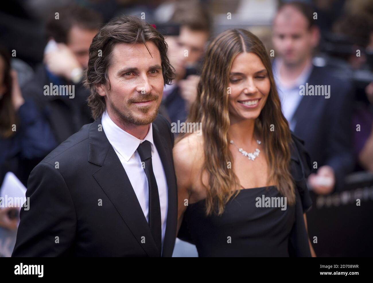 Christian Bale and Sibi Blazic arriving at the premiere of The Dark