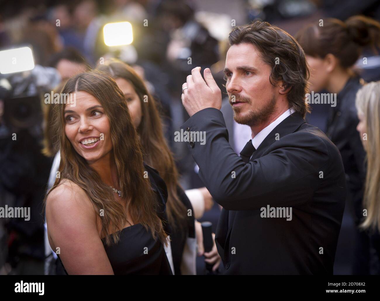 Christian Bale and Sibi Blazic arriving at the premiere of The Dark