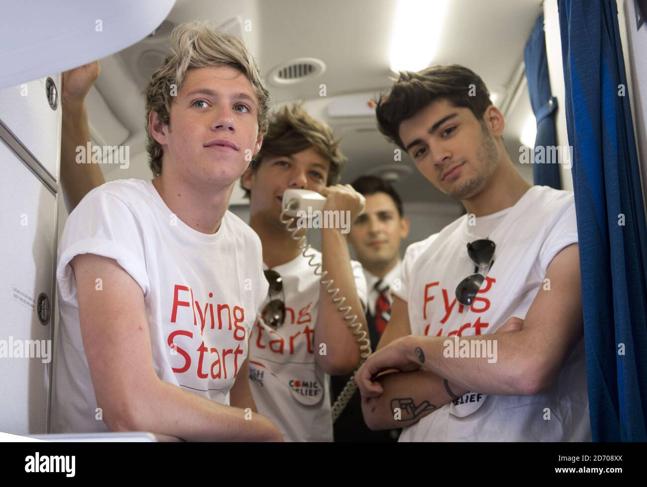 Niall Horan Louis Tomlinson And Zayn Malik Of One Direction Conduct A Quiz For Passengers On Board Flight Ba1d A Private Charter Flight From London To Manchester Hosted By The Band