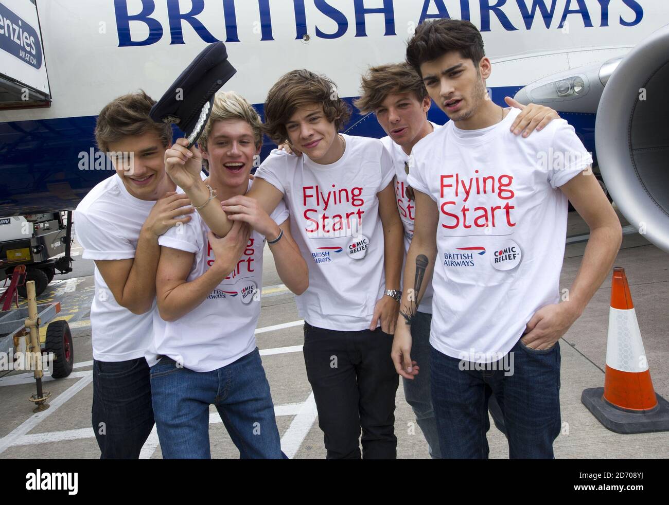 One Direction L R Liam Payne Niall Horan Harry Styles Louis Tomlinson And Zayn Malik Pictured Next To Flight Ba1d A Private Charter Flight From London To Manchester Hosted By The Band