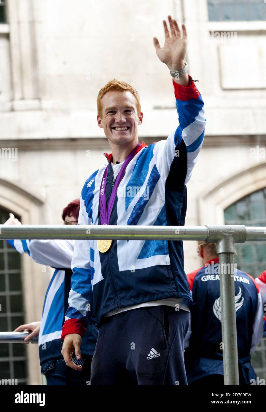 Greg Rutherford Podium Greg Rutherford waves to crowds during the London 2012 Victory Parade ...