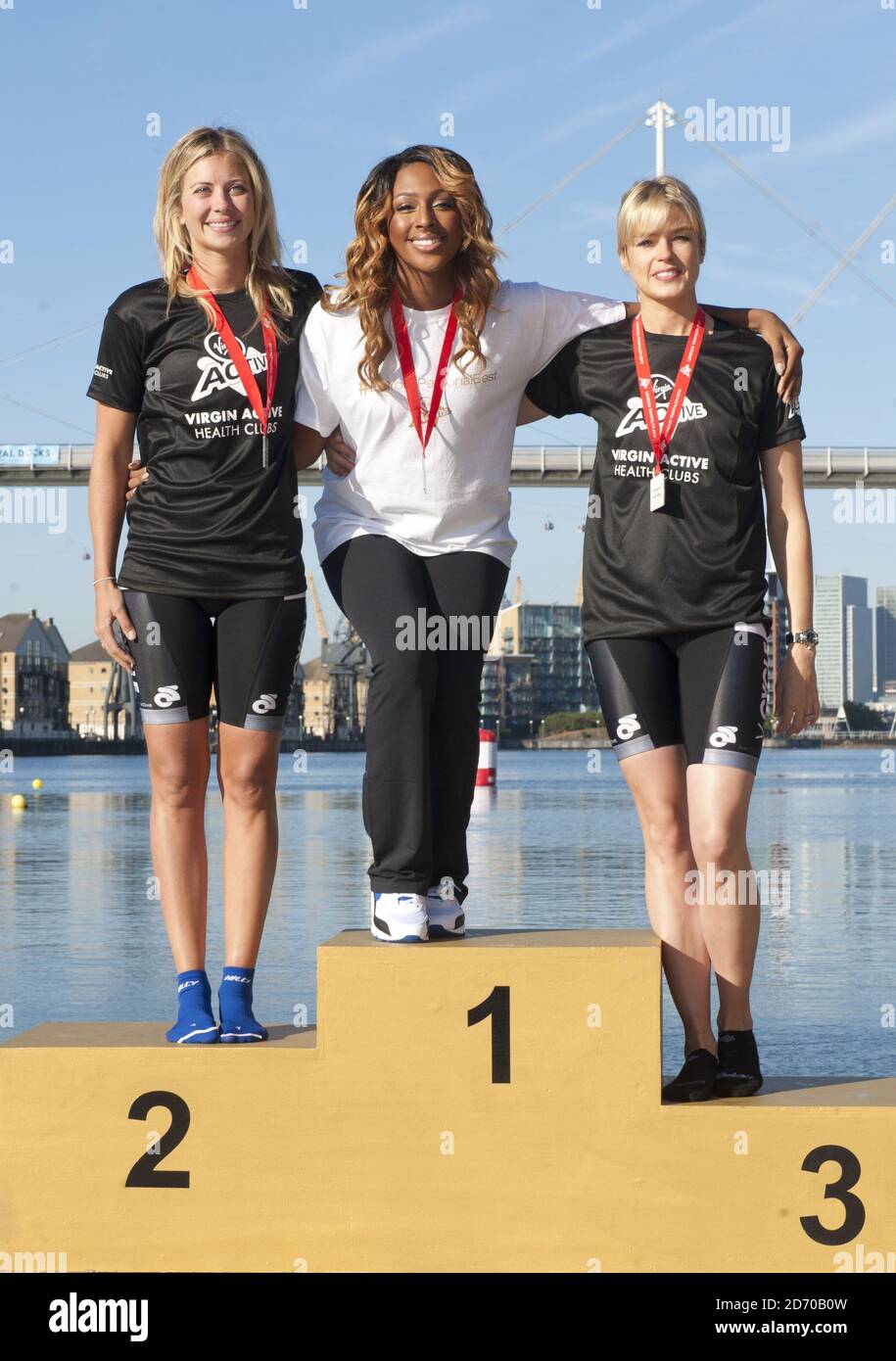 Holly Branson, Alexandra Burke and Isabella Calthorpe at the start of the Virgin Active London Triathlon, which encouraged people to 'Be Your Personal Best', at the Excel Centre in east London. Stock Photo