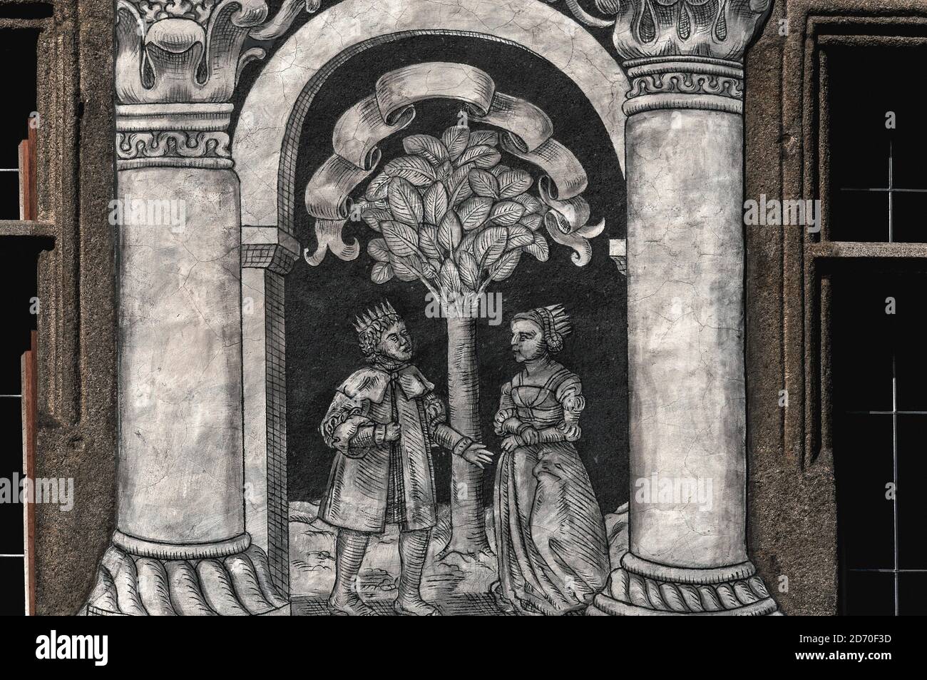 This sgraffito depiction of a Renaissance king and queen conversing on  either side of a tree is one of two scenes, framed by columns, etched  between windows in the ornate restored 16th