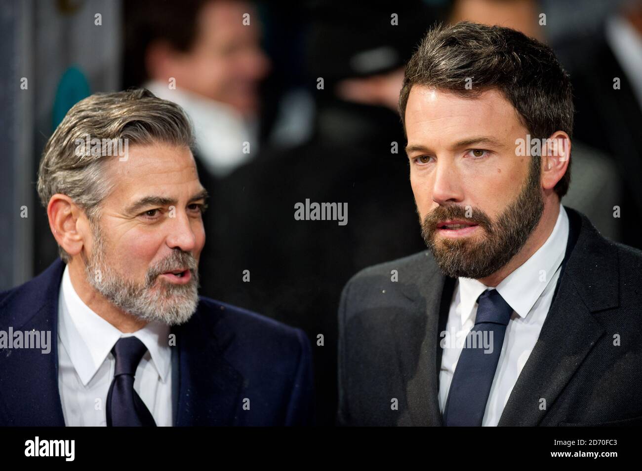 George Clooney and Ben Affleck (right) attending the Bafta Awards, at the Royal Opera House in central London. Stock Photo