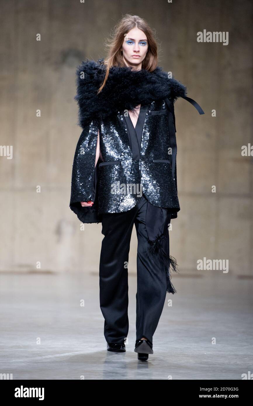 A model wears a design by Top Shop Unique, during the autumn/ winter 2013  catwalk show as part of London Fashion Week at Tate Modern, London Stock  Photo - Alamy