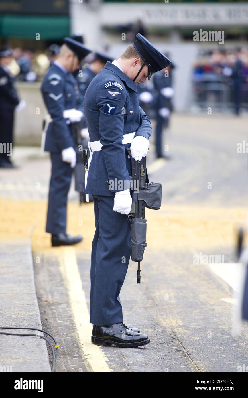 Members of the RAF stand guard at St Clement Dane's Church, during the procession of Baroness Thatcher's coffin to St Paul's Cathedral. Stock Photo
