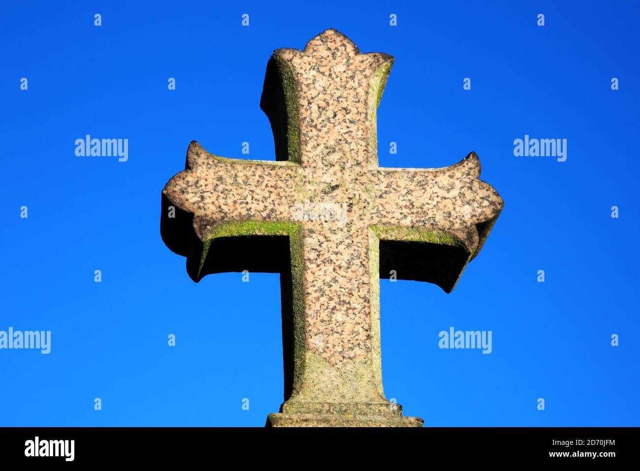 Granite stone religious grave cross the symbol of the Crucifixion of