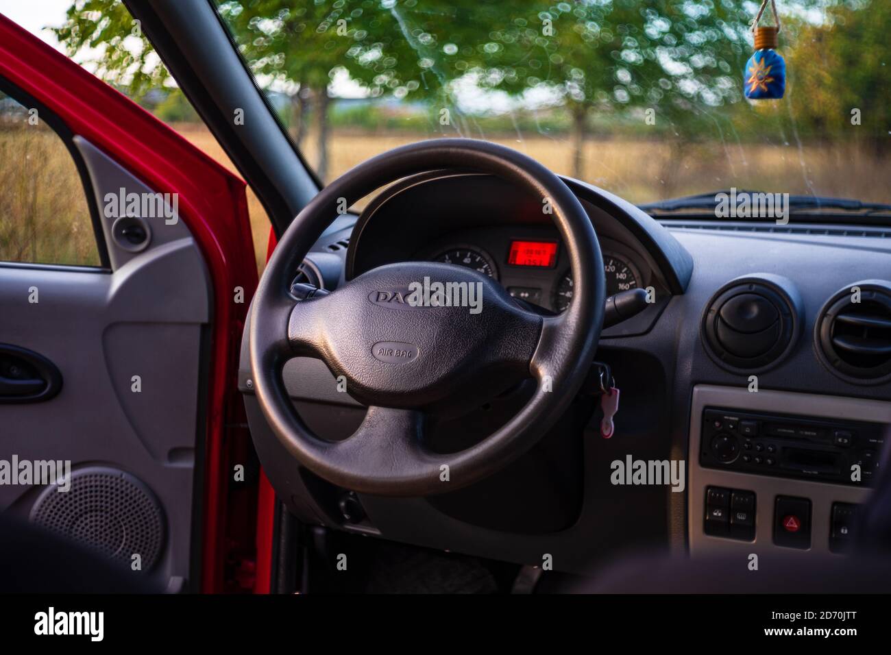 Interior of Dacia Logan, car dashboard close up of steering wheel with air bag sign. Bucharest, Romania, 2020 Stock Photo