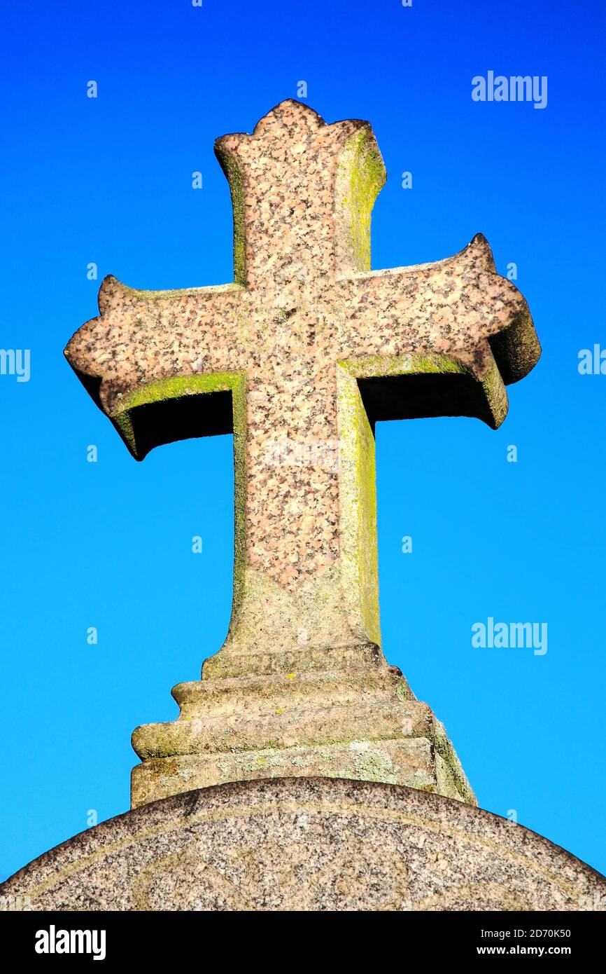 Granite stone religious grave cross the symbol of the Crucifixion of