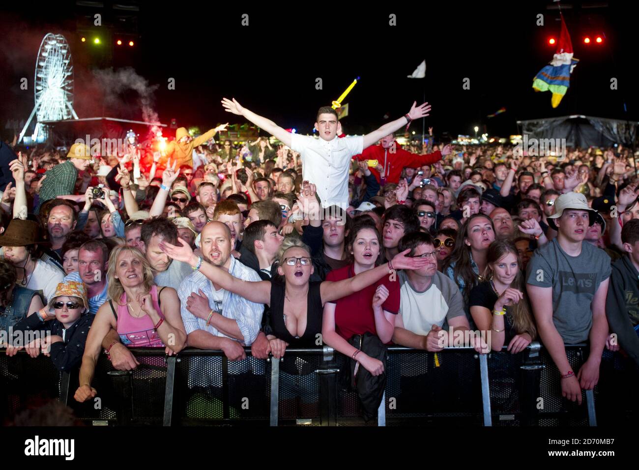 The crowd watch The Stone Roses performing at the Isle of Wight ...