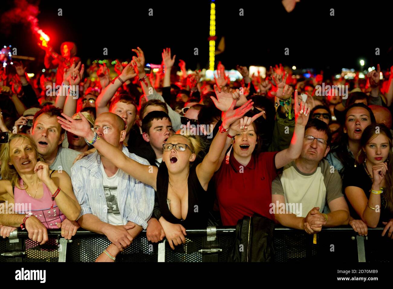 The crowd watch The Stone Roses performing at the Isle of Wight ...