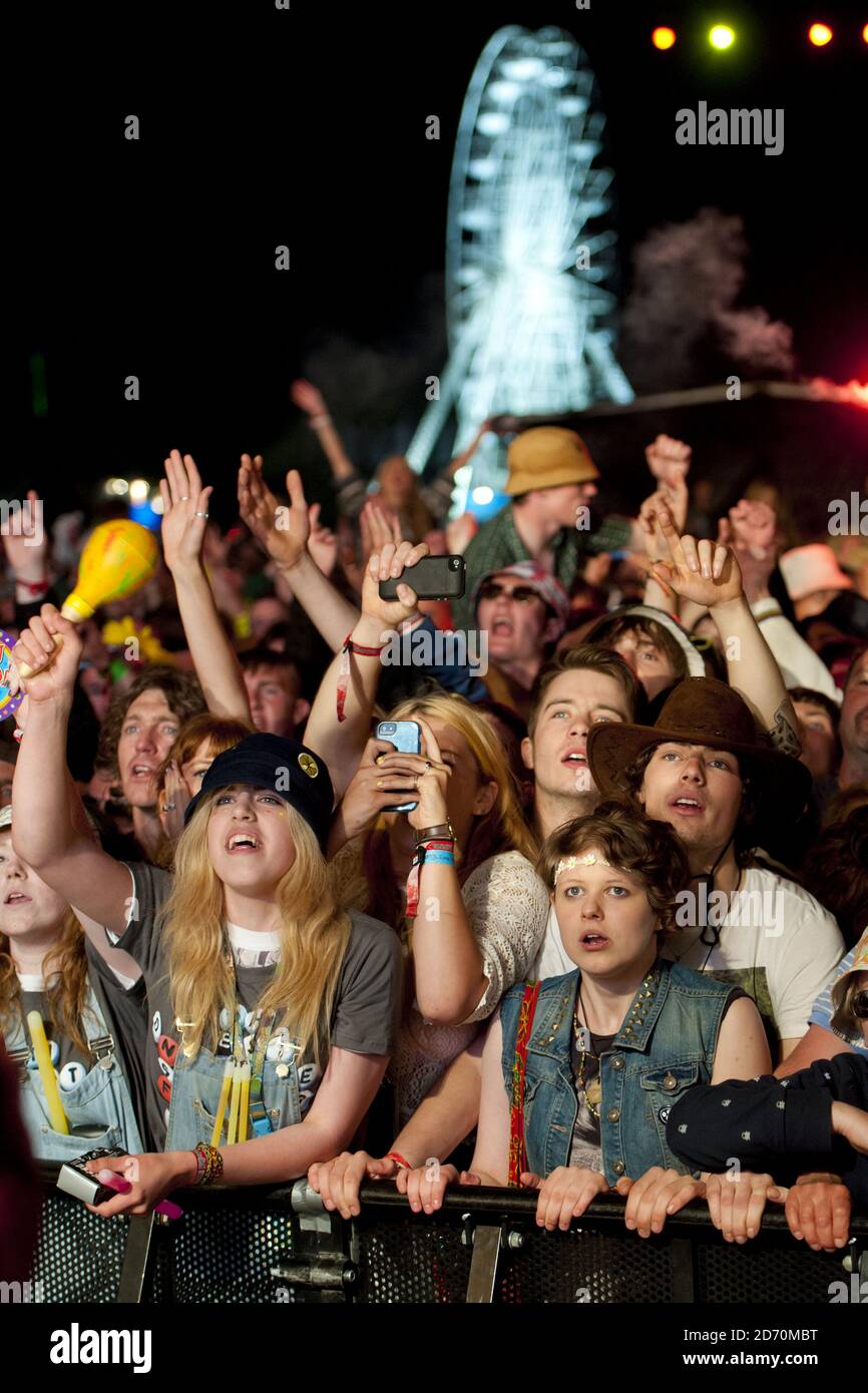 The crowd watch The Stone Roses performing at the Isle of Wight ...