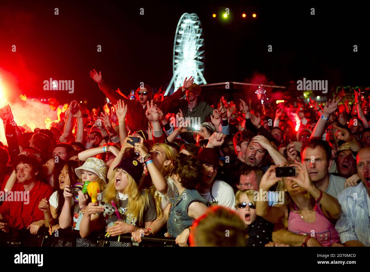 The crowd watch The Stone Roses performing at the Isle of Wight ...