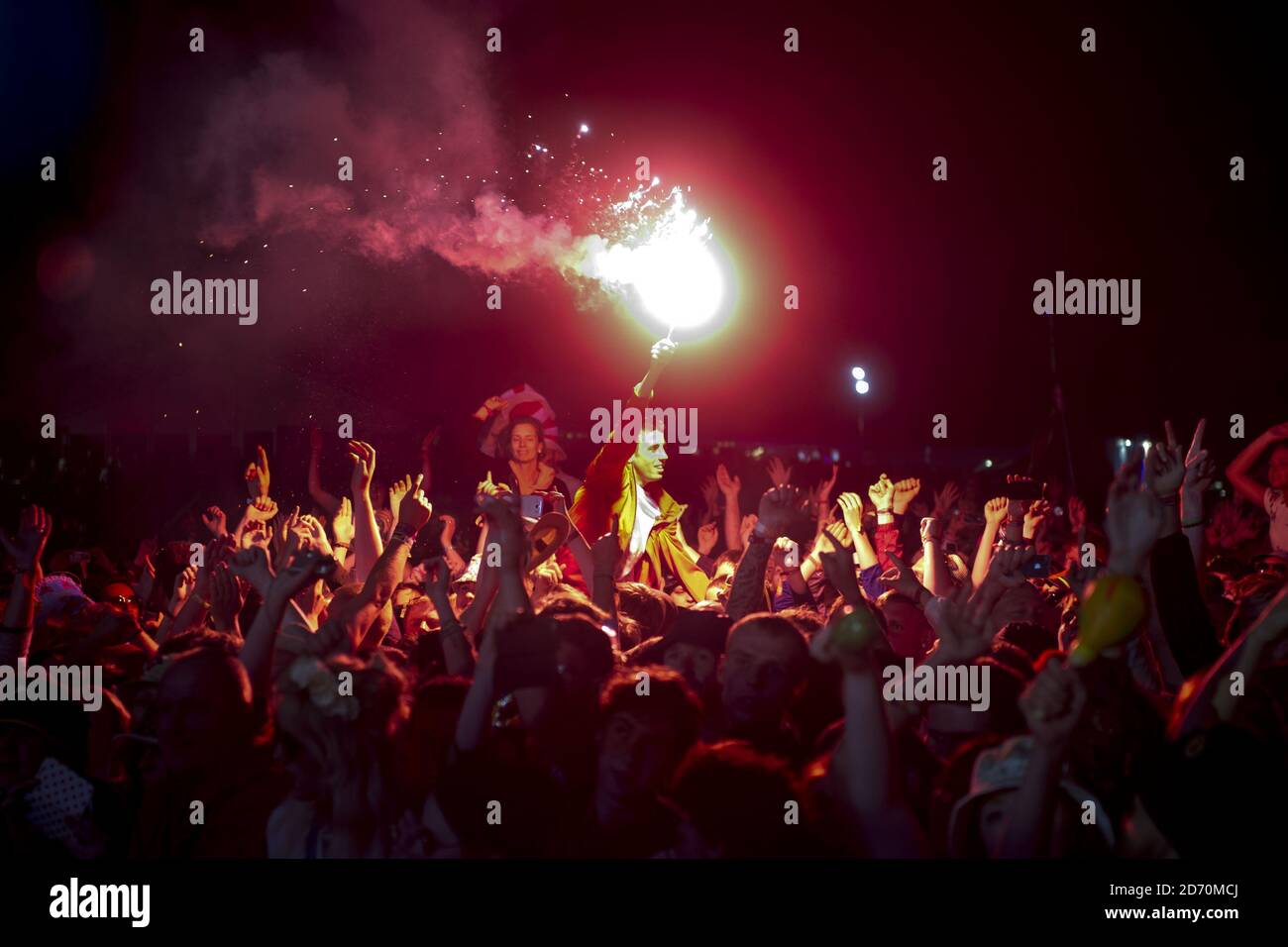 The crowd watch The Stone Roses performing at the Isle of Wight ...