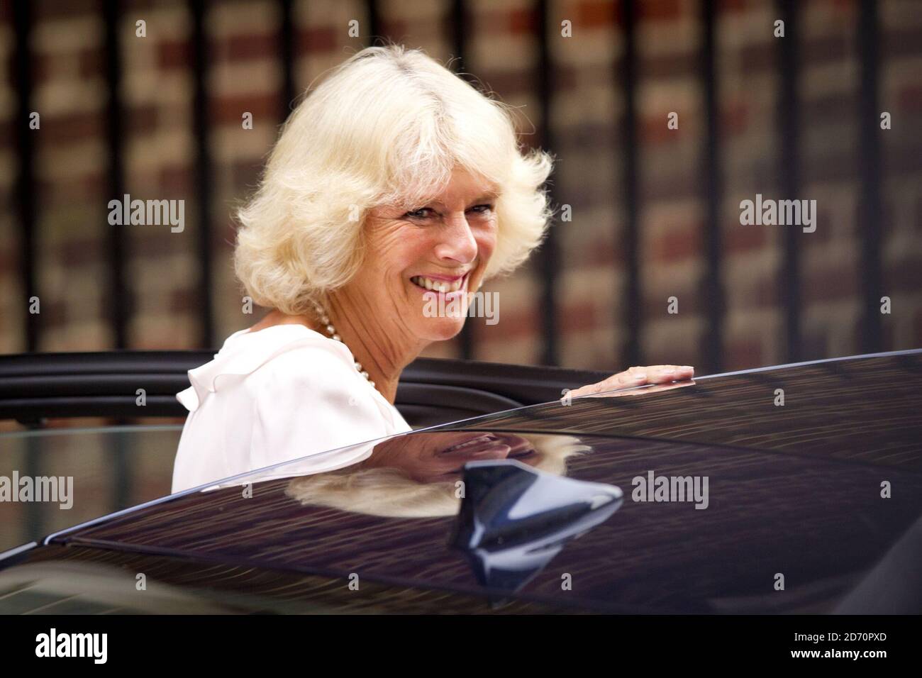 The Duchess of Cornwall pictured after she visits The Duchess of Cambridge, Prince William and their newborn son pictured outside the Lindo Wing at St Mary's Hospital, London. Stock Photo