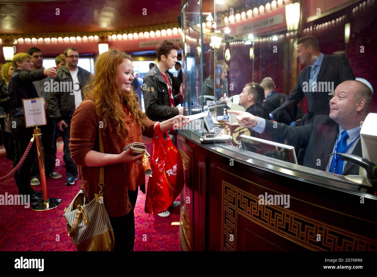 Charlotte Thompson from Solihull buys tickets for Miss Saigon, at the Prince Edward theatre in central London. Tickets for the show (opening May 2014) went on sale at 10am today, and sales set a new record for the largest single day of sales in West End and Broadway history. Stock Photo