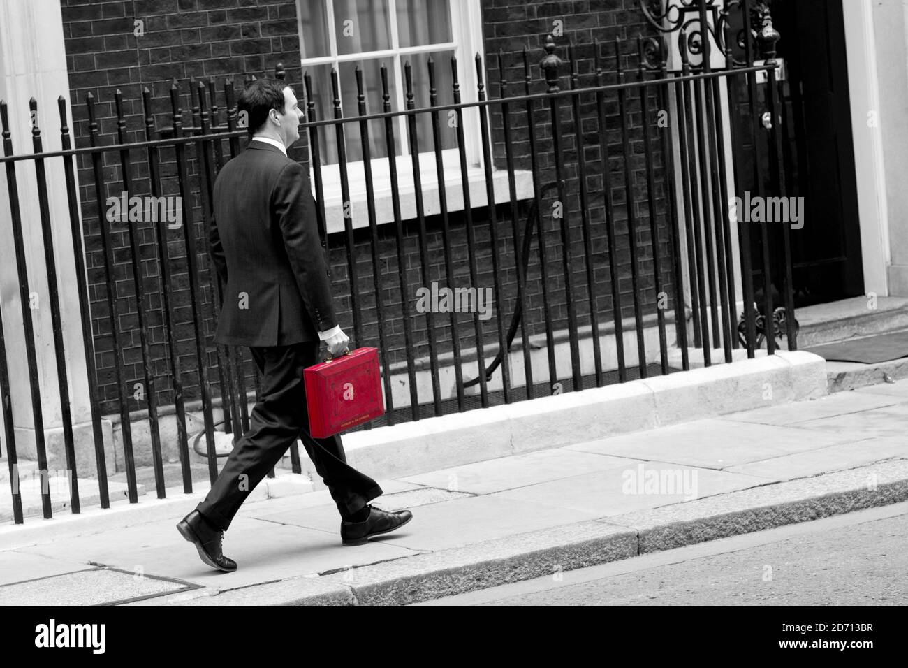 George Osborne leaves Downing Street before delivering his 2014 budget announcement at the House of Commons.  Stock Photo