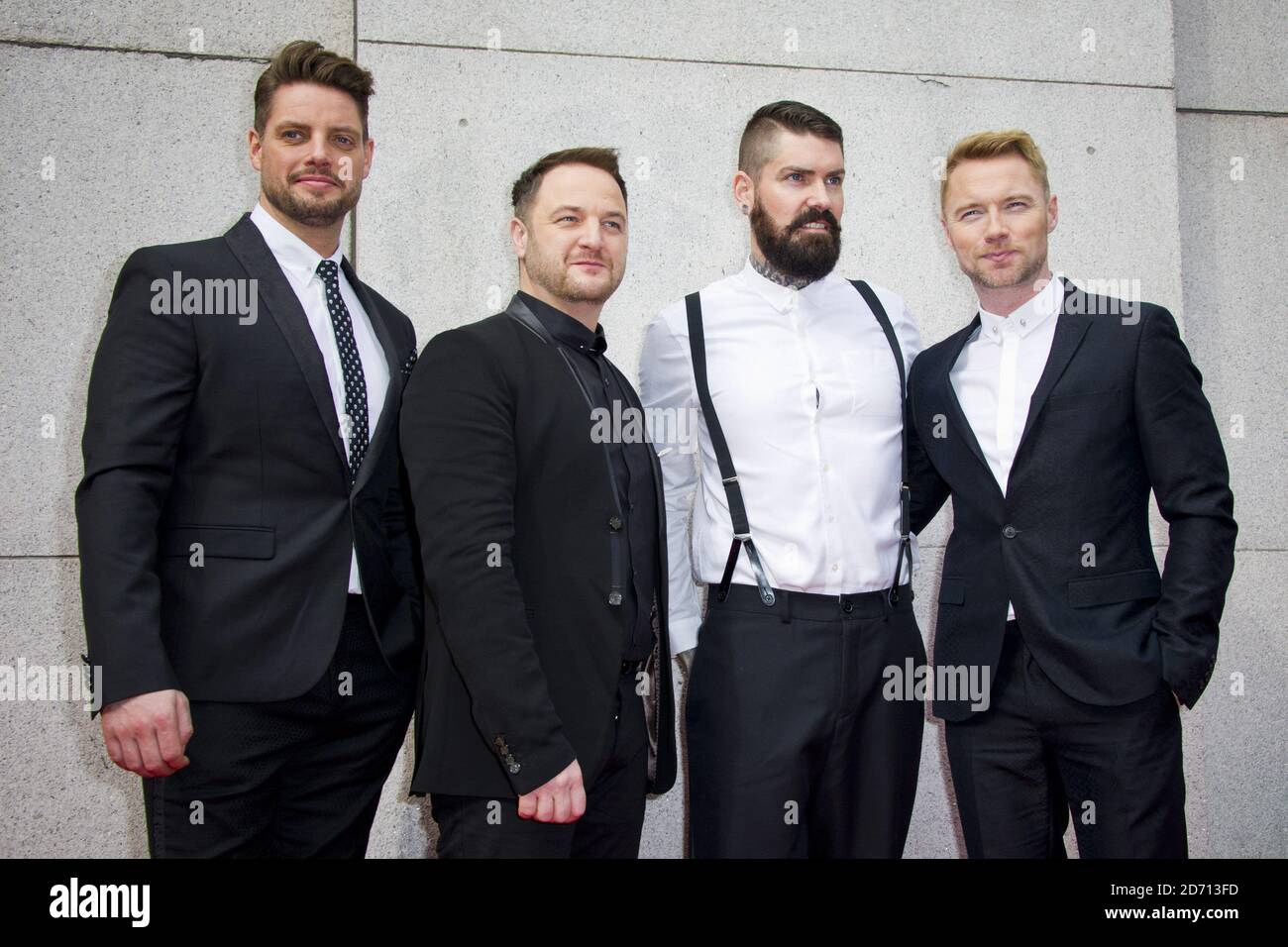 Keith Duffy, Mikey Graham, Shane Lynch and Ronan Keating of Boyzone attending the Tesco Mum of the Year awards, at the Savoy Hotel in London. Stock Photo