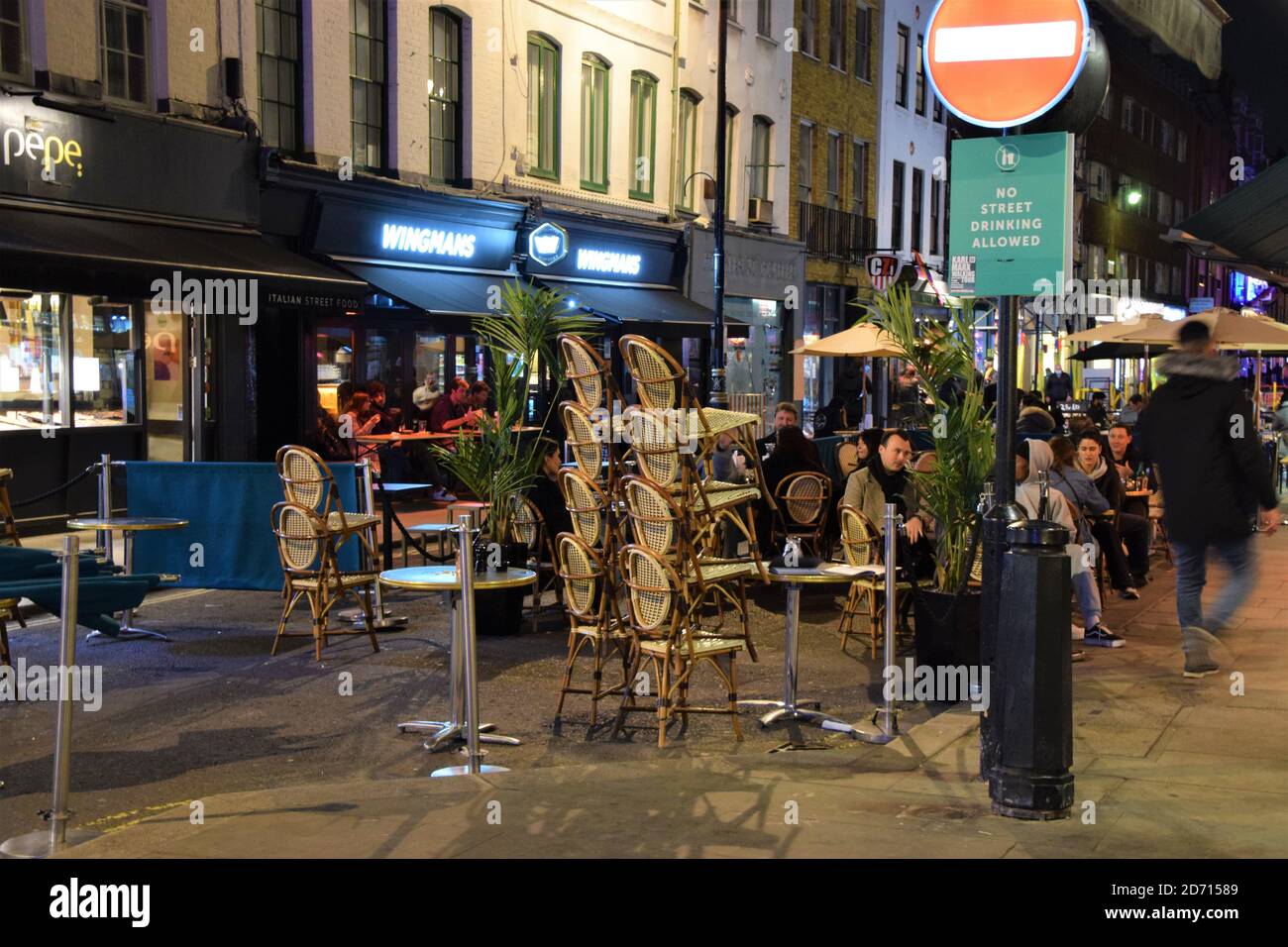 Restaurants and bars closing early on Old Compton Street, Soho. New curfew and social distancing rules mean that bars and restaurants in London must close earlier than in recent months, with many already shut by 9 pm. Stock Photo