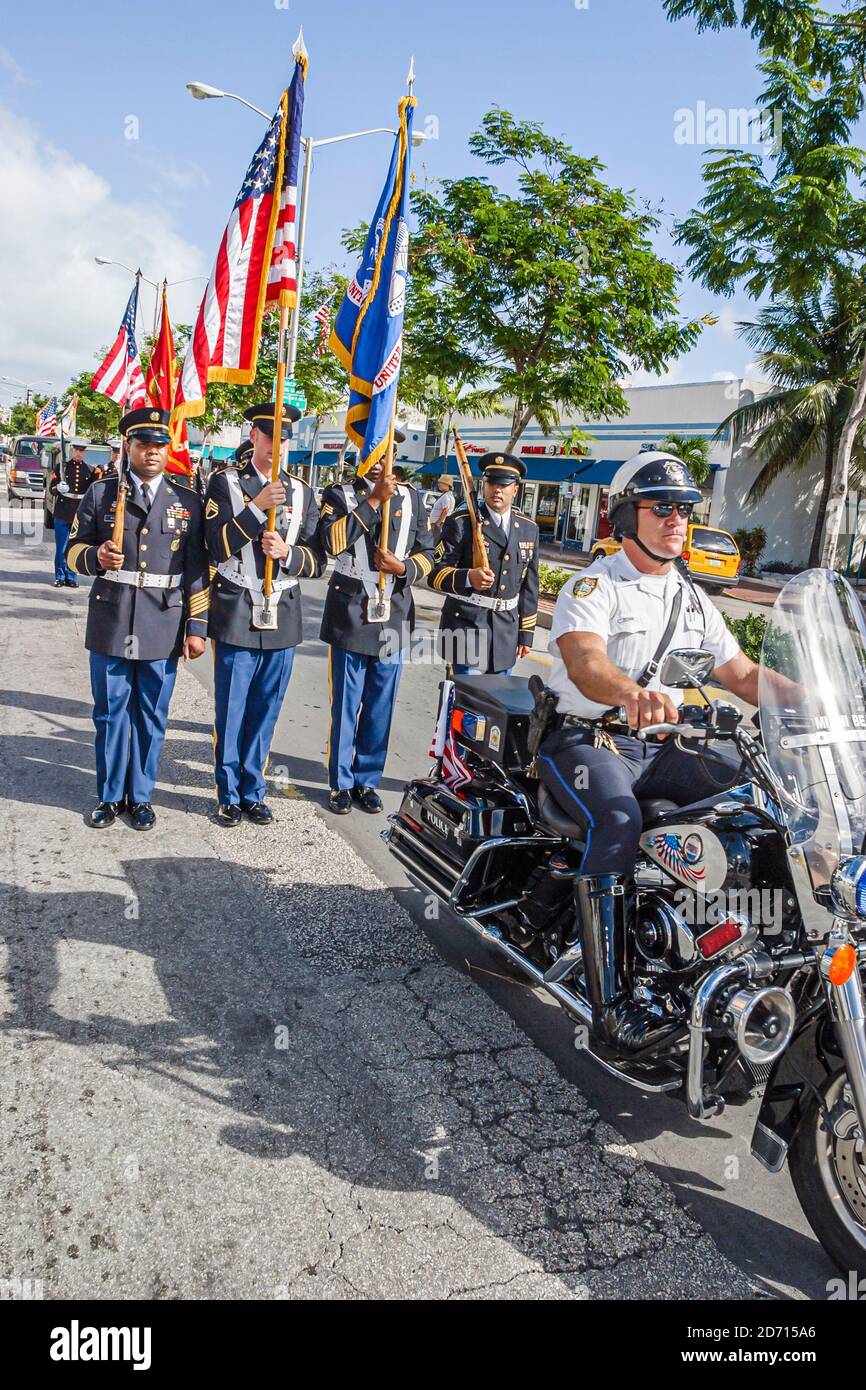 Miami Beach Florida,Washington Avenue Veterans' Day parade,police policemen flag bearing color colour guard motorcycle, Stock Photo