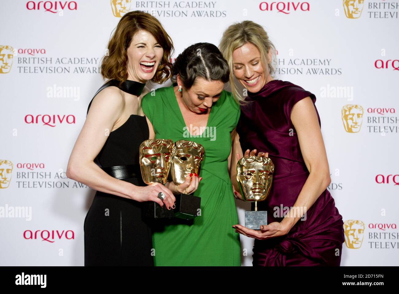 (left to right) Jodie Whittaker, Olivia Colman and Simone McAullay with the Drama Series Award for Broadchurch, at the 2014 Arqiva British Academy Television Awards at the Theatre Royal, Drury Lane, London. Stock Photo