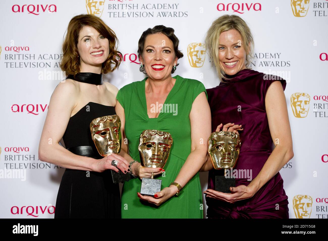 (left to right) Jodie Whittaker, Olivia Colman and Simone McAullay with the Drama Series Award for Broadchurch, at the 2014 Arqiva British Academy Television Awards at the Theatre Royal, Drury Lane, London. Stock Photo