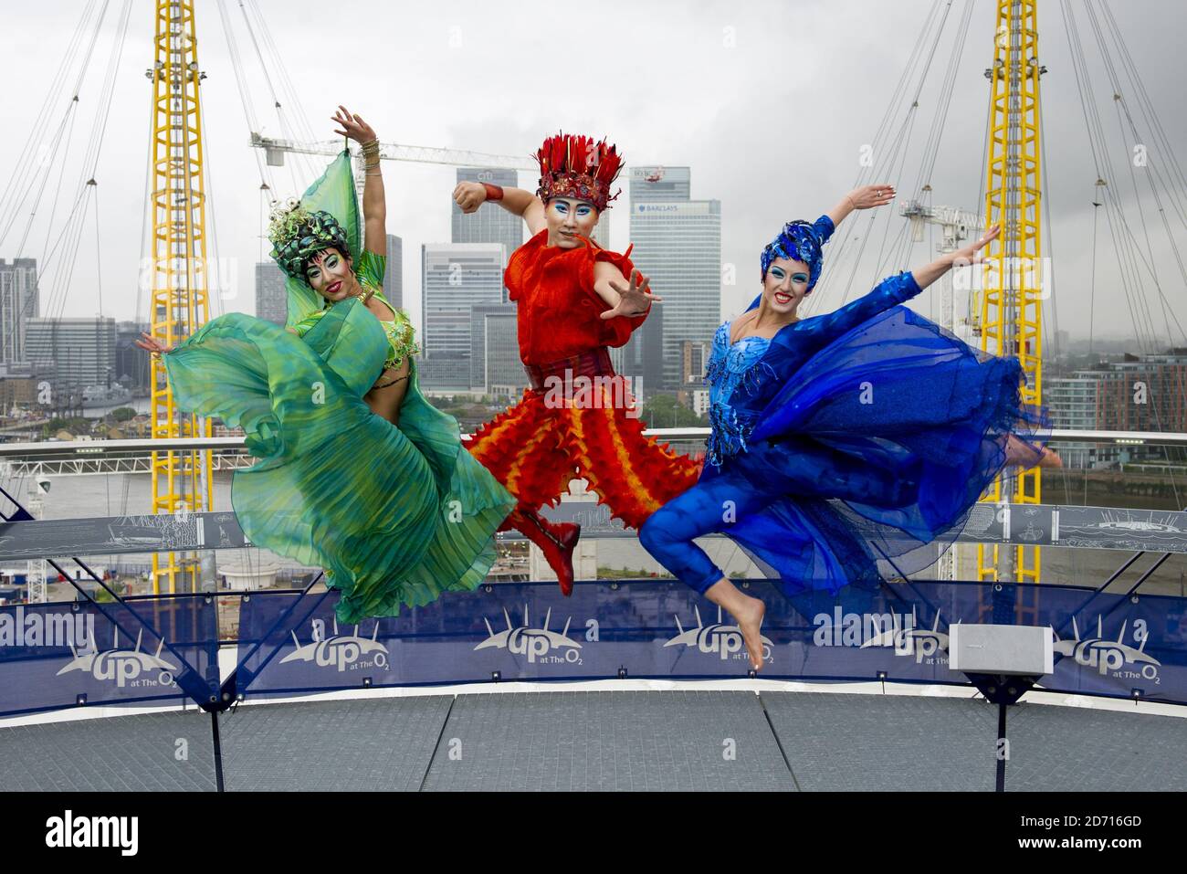 Characters representing water (Oceane), air (Azala) and fire (Yao) from Dralion, Cirque du Soleil, pose at Up At the O2, At The O2 arena in east London. Dralion runs from 4th - 8th June at The O2 Stock Photo