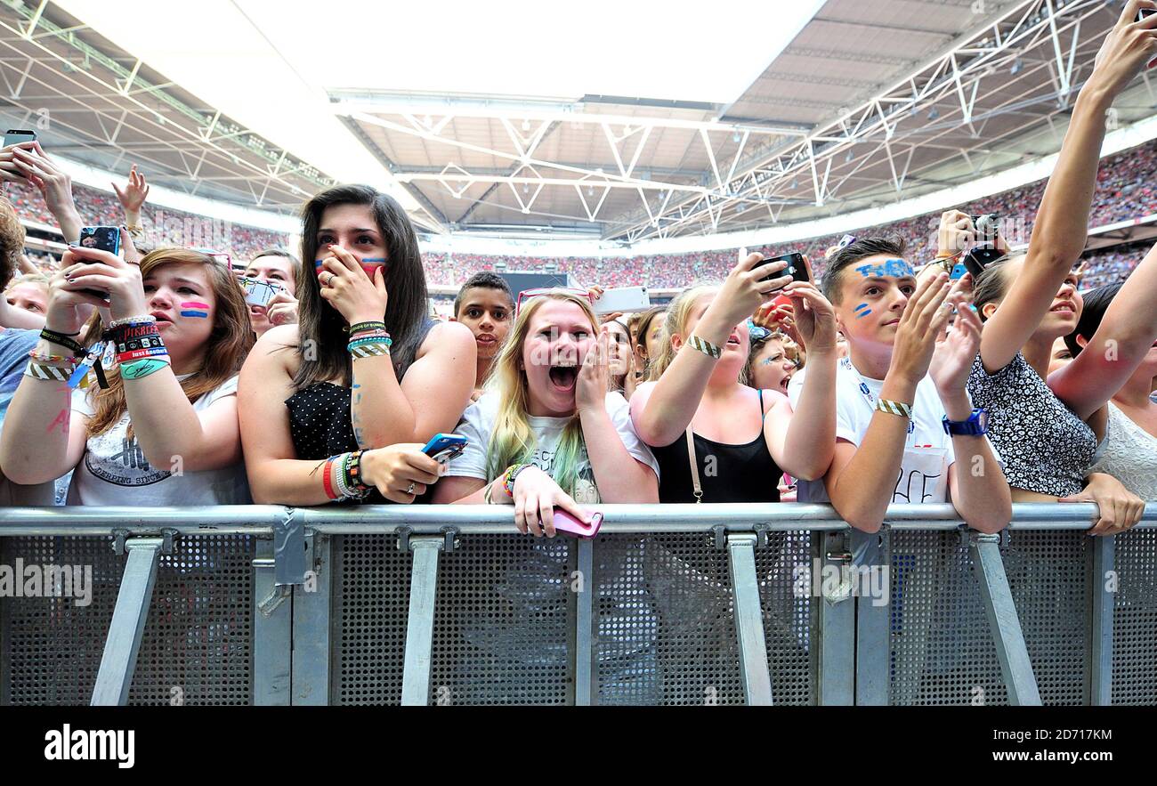 Fans cheer as 5 Seconds of Summer perform during Capital FM's Summertime Ball at Wembley Stadium ...