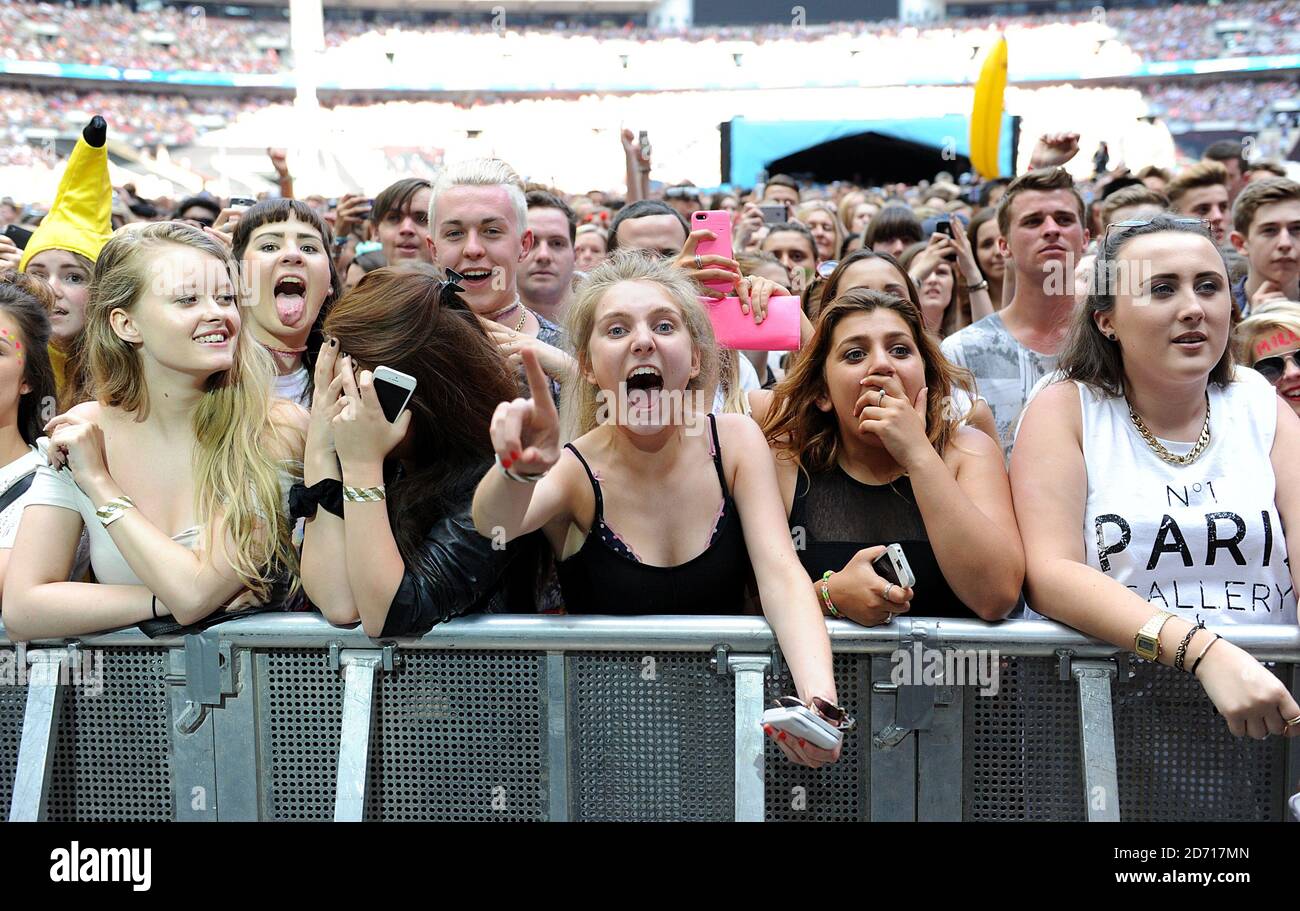 Fans cheer as 5 Seconds of Summer perform during Capital FM's Summertime Ball at Wembley Stadium ...