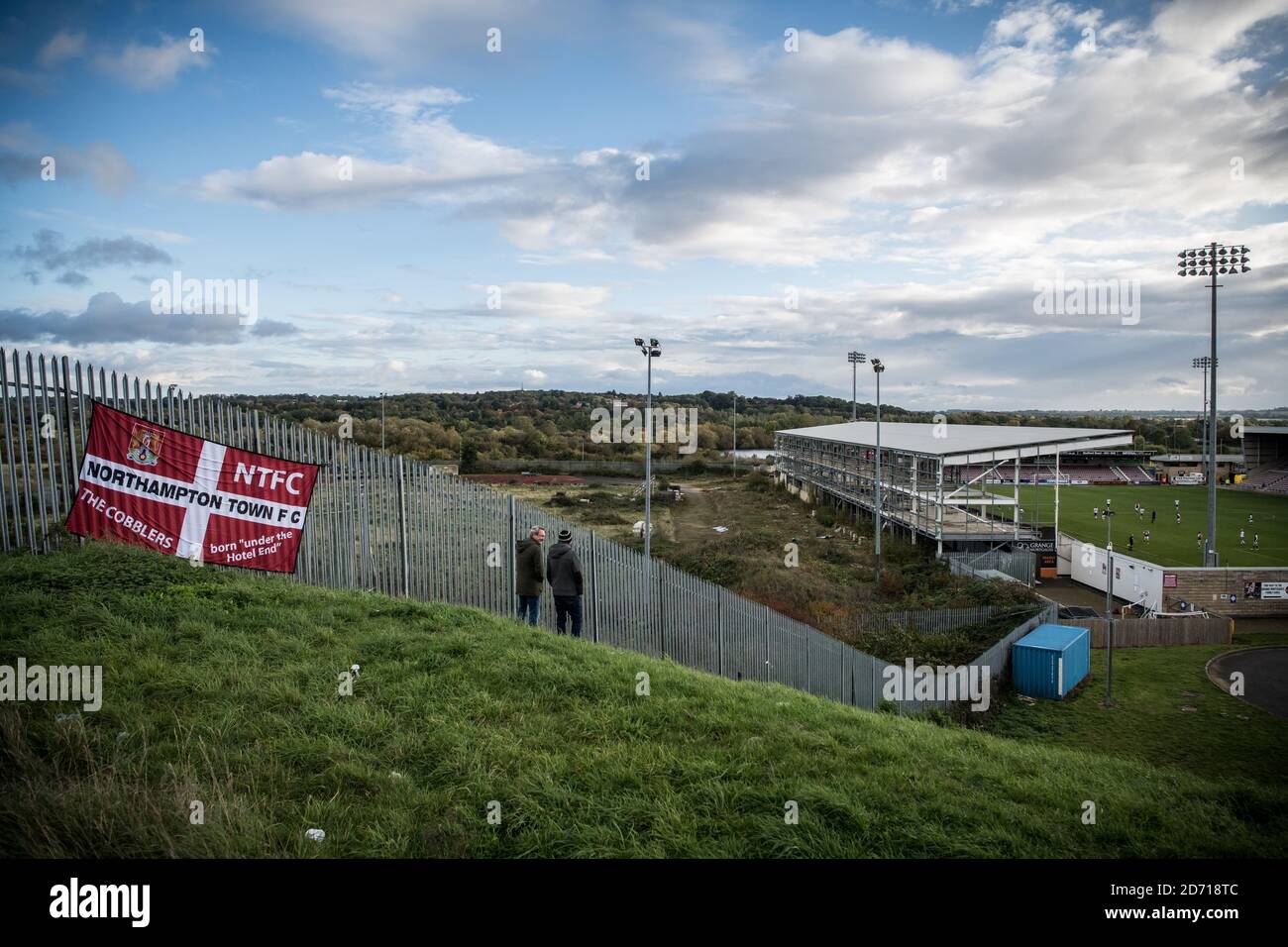 Northampton Town 0 Peterborough United 2, 10/09/2020. Sixfields Stadium, League One. Fans gather on the hill outside the stadium to watch the action. Stock Photo