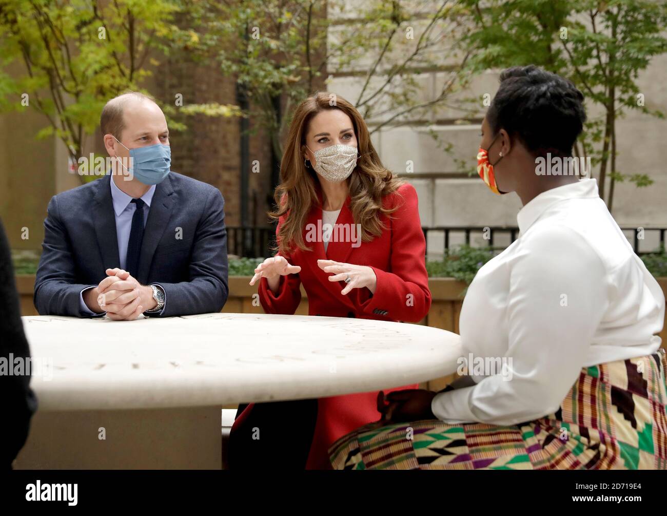 The Duke and Duchess of Cambridge meet pharmacist Joyce Duah during a visit to St. Bartholomew's Hospital in London, to mark the launch of the Hold Still photography project. Stock Photo