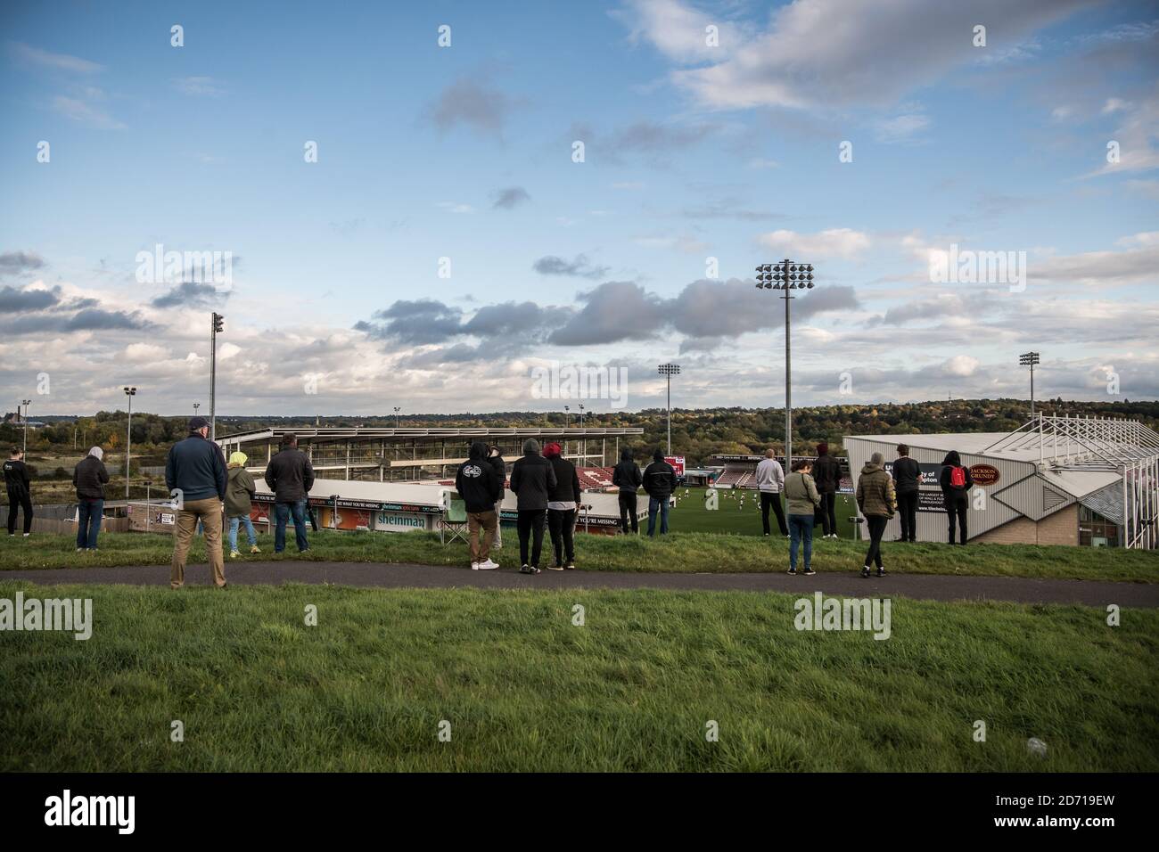 Northampton Town 0 Peterborough United 2, 10/09/2020. Sixfields Stadium, League One. Fans gather on the hill outside the stadium to watch the action. Stock Photo