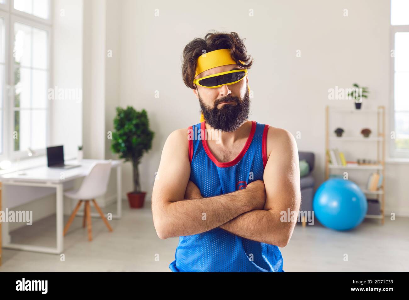 Portrait of a serious focused and at the same time funny athlete in fashionable trendy glasses. Stock Photo